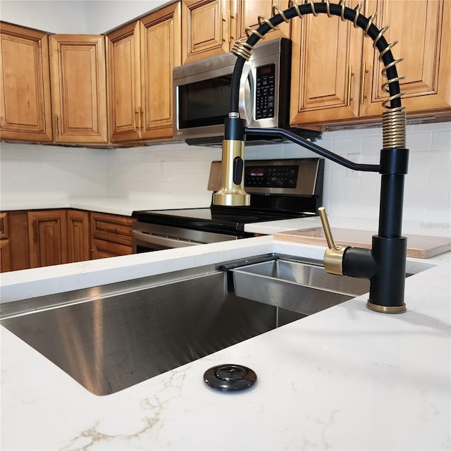 kitchen featuring backsplash and stainless steel appliances