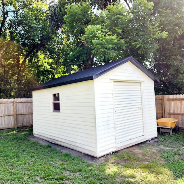 view of shed with a fenced backyard