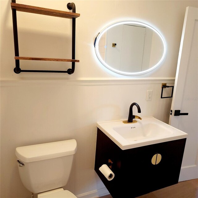 bathroom with vanity and toilet