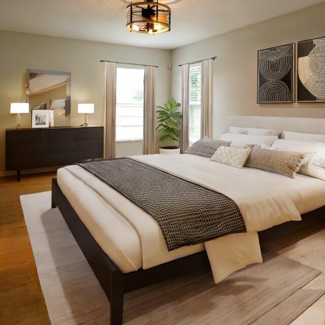 bedroom with light hardwood / wood-style floors