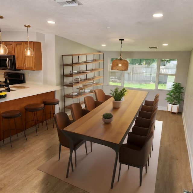 dining space featuring light hardwood / wood-style flooring