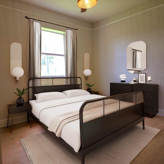 bedroom featuring light wood-type flooring and baseboards