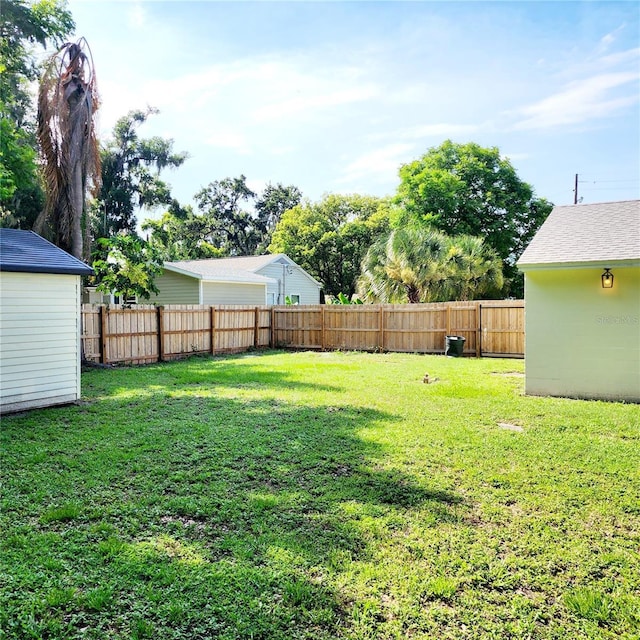 view of yard with a fenced backyard