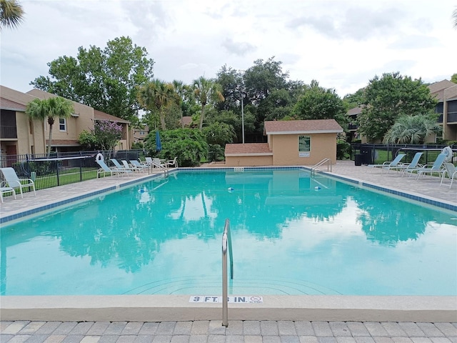 view of swimming pool with a patio