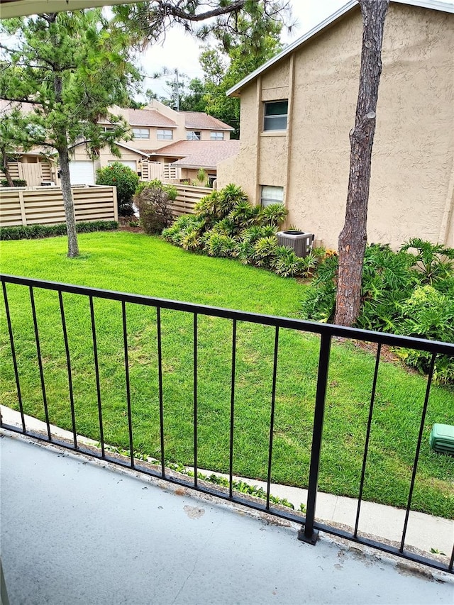 view of yard with a balcony