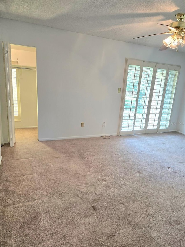 1019 Grove St Unit 85, Maitland, FL 32751 - carpeted empty room featuring a ceiling fan, a textured ceiling, and baseboards