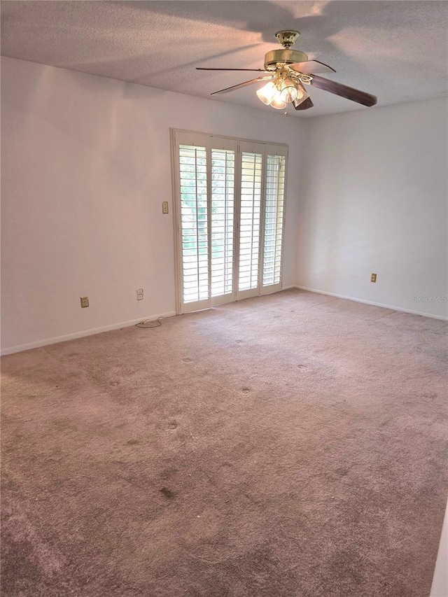 1019 Grove St Unit 85, Maitland, FL 32751 - unfurnished room featuring a textured ceiling, ceiling fan, light colored carpet, and baseboards