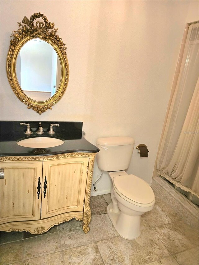 1019 Grove St Unit 85, Maitland, FL 32751 - bathroom featuring toilet, curtained shower, vanity, and baseboards