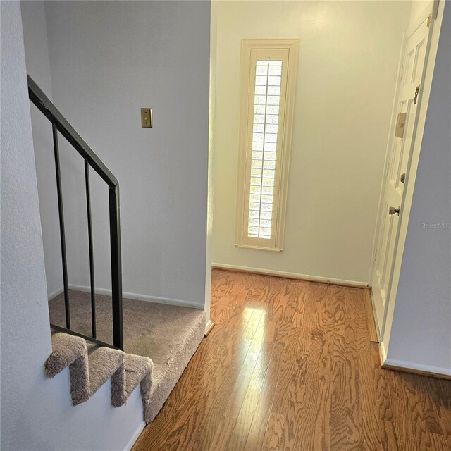 1019 Grove St Unit 85, Maitland, FL 32751 - entrance foyer with stairway, wood finished floors, and baseboards