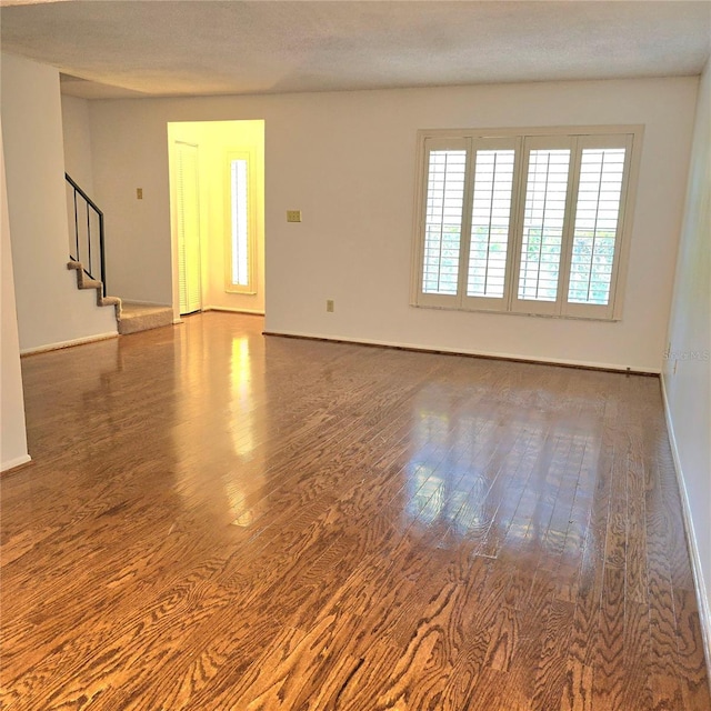 1019 Grove St Unit 85, Maitland, FL 32751 - spare room with wood finished floors, baseboards, and stairs