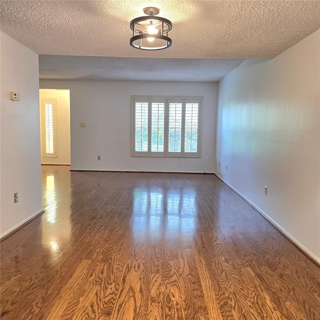 1019 Grove St Unit 85, Maitland, FL 32751 - empty room with baseboards, wood finished floors, and a textured ceiling