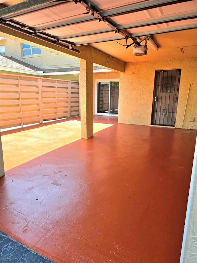 1019 Grove St Unit 85, Maitland, FL 32751 - garage with a garage door opener and fence
