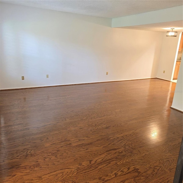 1019 Grove St Unit 85, Maitland, FL 32751 - spare room featuring baseboards and dark wood finished floors
