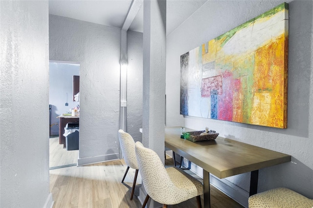 dining room with hardwood / wood-style floors