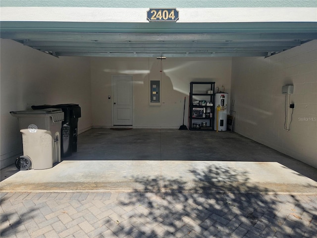 garage featuring electric panel and water heater