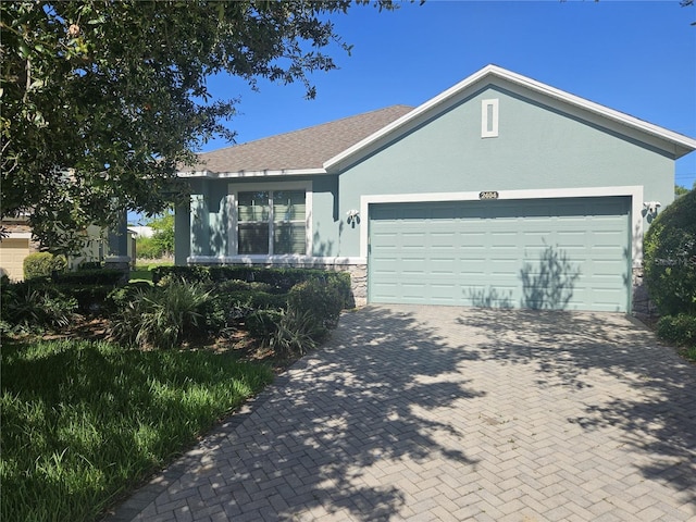 ranch-style house featuring a garage