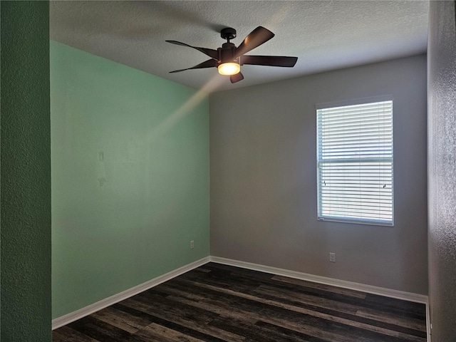 unfurnished room featuring a textured ceiling, dark wood-type flooring, and ceiling fan