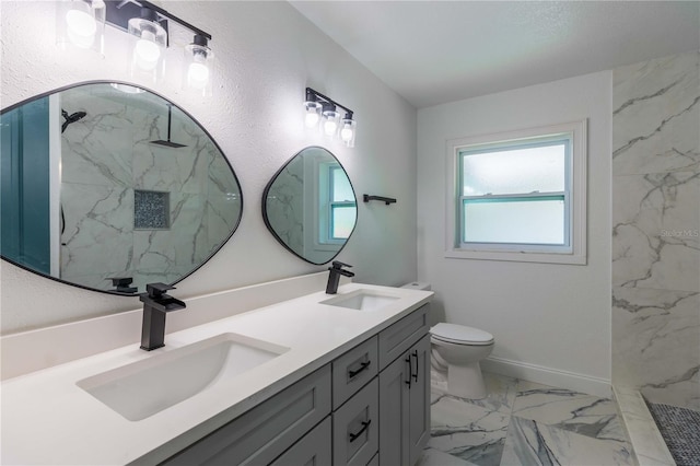 bathroom featuring a shower, vanity, and toilet