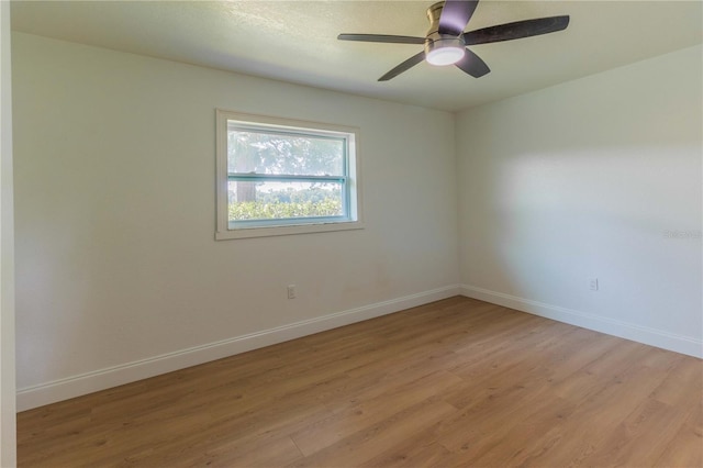 unfurnished room featuring ceiling fan and light hardwood / wood-style flooring