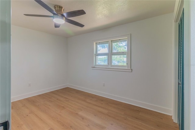 unfurnished room with ceiling fan and light hardwood / wood-style flooring