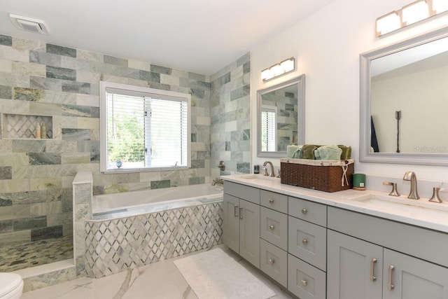 bathroom with vanity, tile walls, and plus walk in shower