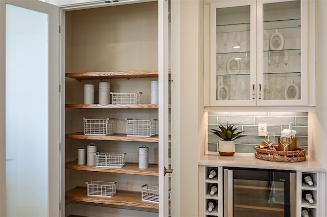 pantry featuring wine cooler