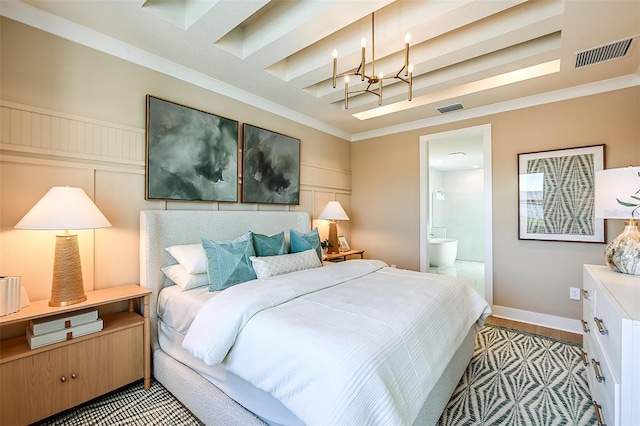 bedroom featuring connected bathroom, crown molding, and light hardwood / wood-style flooring