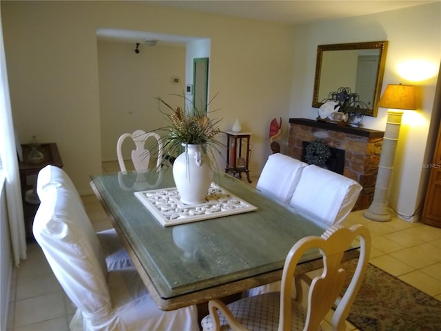 1608 Bob O Link Dr, Venice, FL 34293 - dining space featuring a stone fireplace and light tile patterned floors