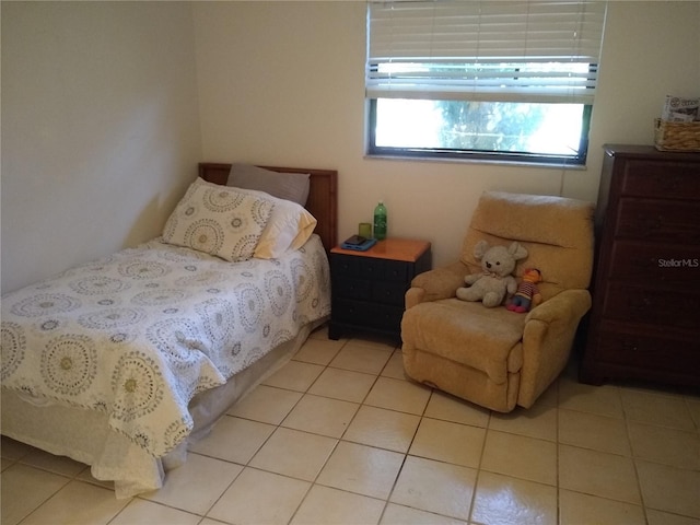 bedroom featuring light tile patterned floors