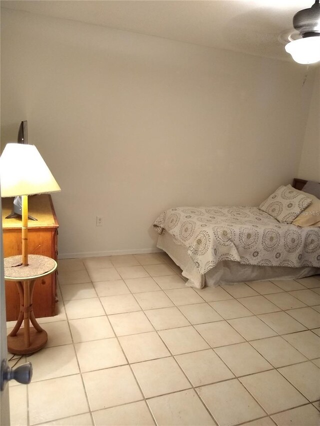 bedroom featuring ceiling fan and light tile patterned floors