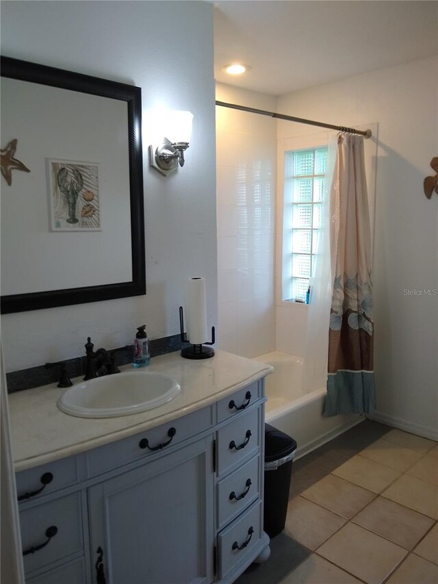 bathroom featuring vanity, tile patterned floors, and shower / bathtub combination with curtain