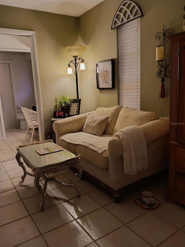 1608 Bob O Link Dr, Venice, FL 34293 - living area with light tile patterned floors and a textured wall
