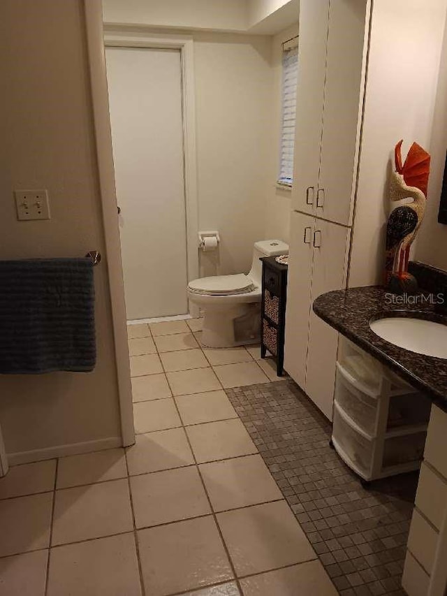 1608 Bob O Link Dr, Venice, FL 34293 - half bath with tile patterned flooring, toilet, and a sink