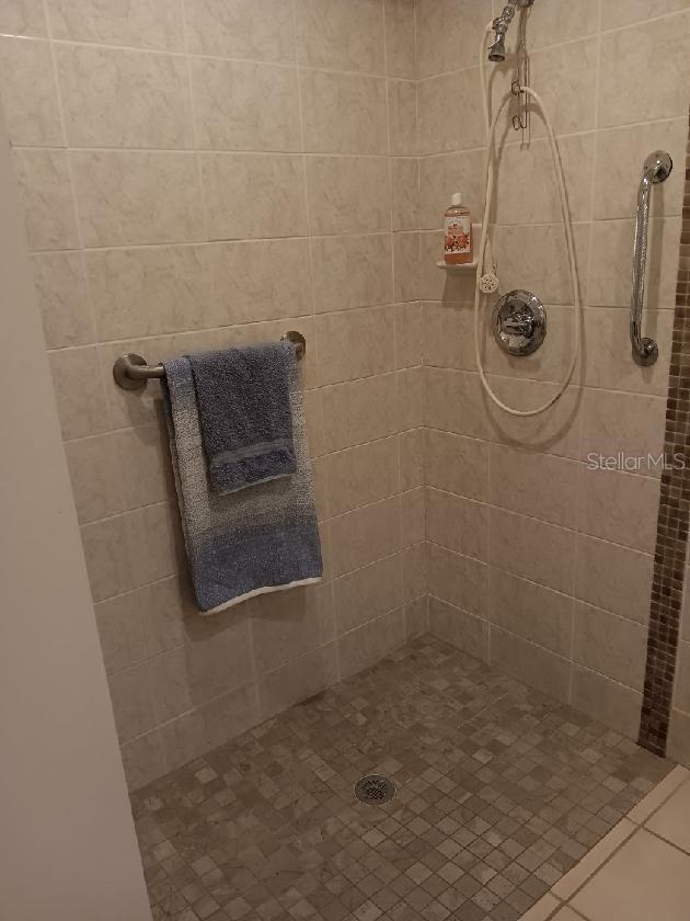 1608 Bob O Link Dr, Venice, FL 34293 - bathroom with a tile shower
