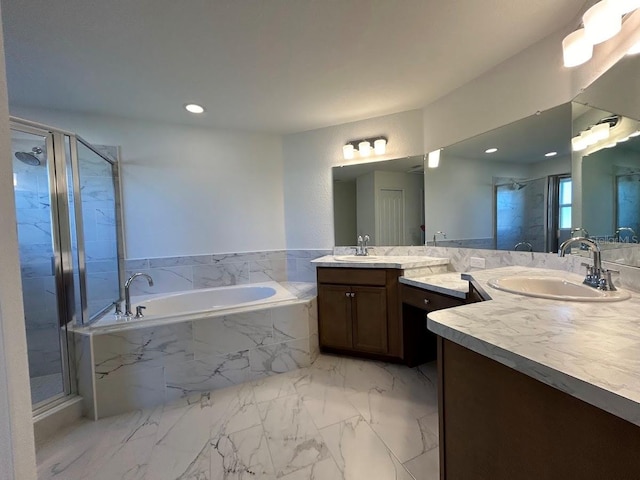 bathroom with shower with separate bathtub and vanity