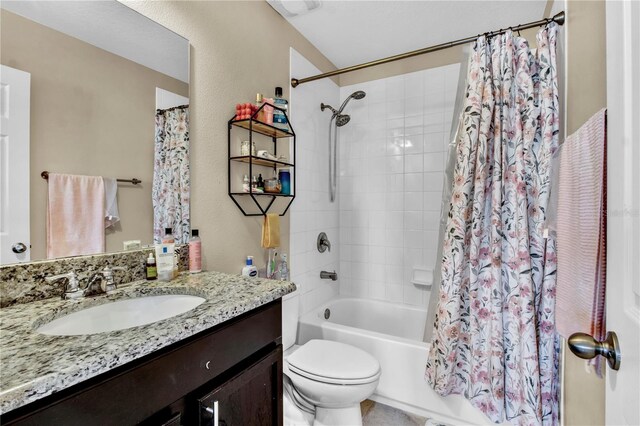 full bathroom featuring vanity, toilet, and shower / tub combo