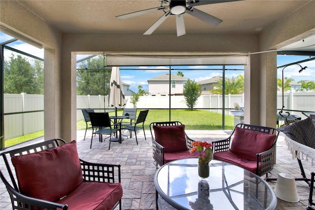 sunroom / solarium with ceiling fan