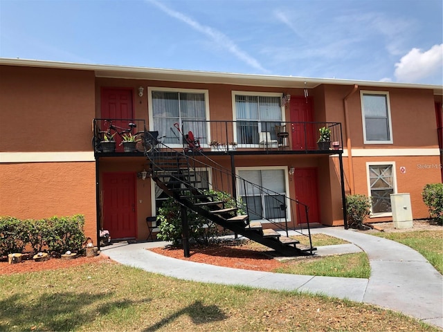 view of property with a balcony