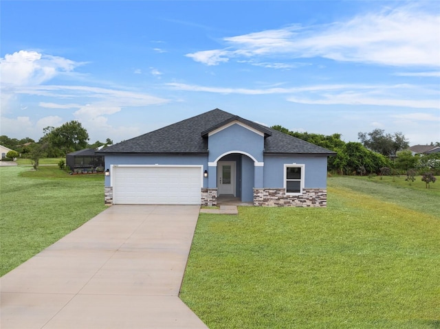 view of front of home featuring a garage and a front lawn