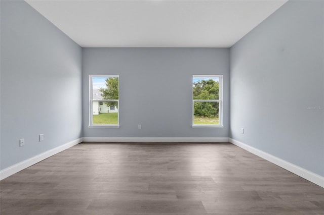 unfurnished room featuring wood-type flooring