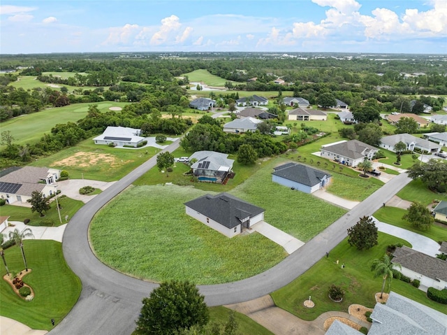 aerial view featuring view of golf course and a residential view