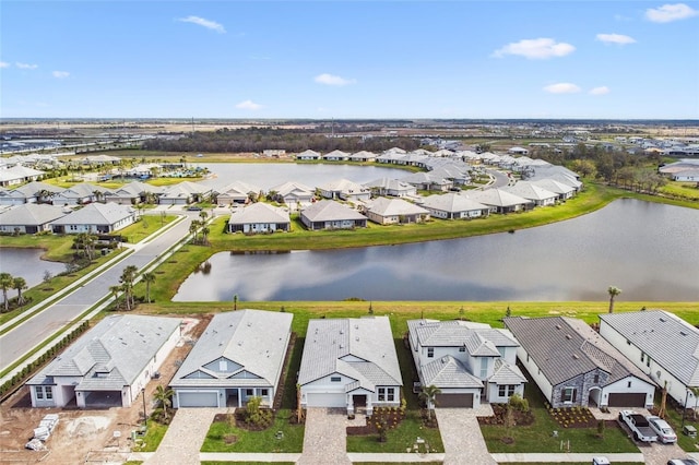 aerial view with a residential view and a water view