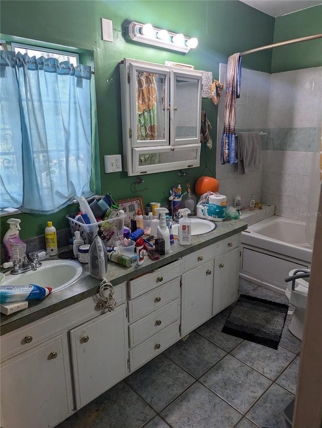 bathroom with tile patterned flooring, vanity, and shower / bathtub combination with curtain