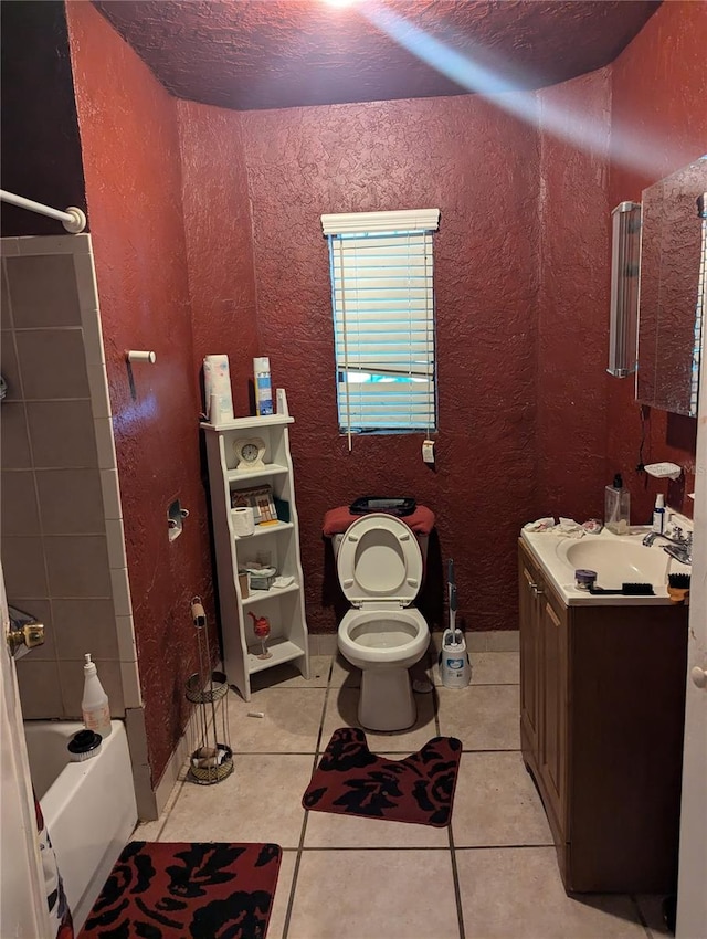 full bathroom featuring tile patterned flooring, a textured ceiling, shower / bath combination, vanity, and toilet