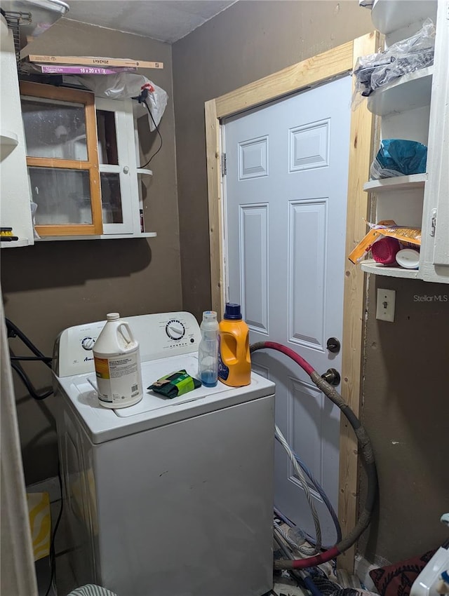 washroom with washer / dryer