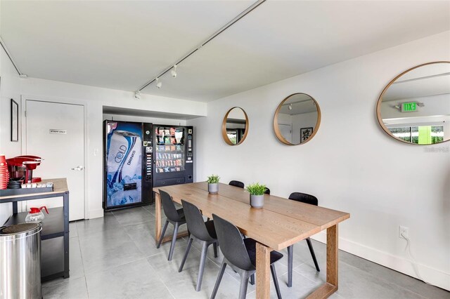 tiled dining room with track lighting