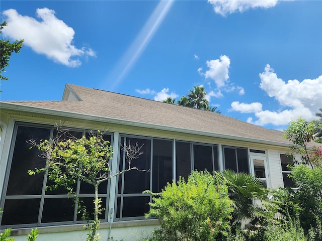 view of side of home featuring a sunroom