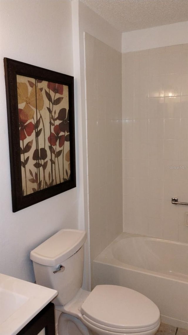 full bathroom featuring vanity, shower / bathtub combination, toilet, and a textured ceiling