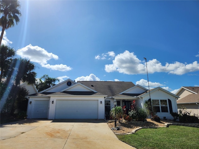 single story home with a front yard and a garage