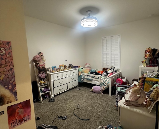 bedroom featuring dark carpet